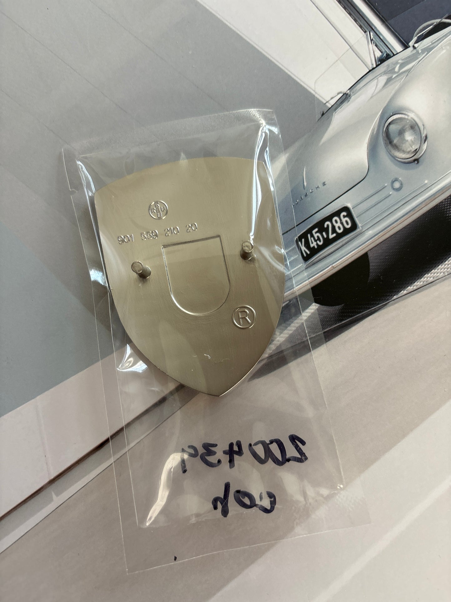 Porsche, red white and blue Crest hood badge