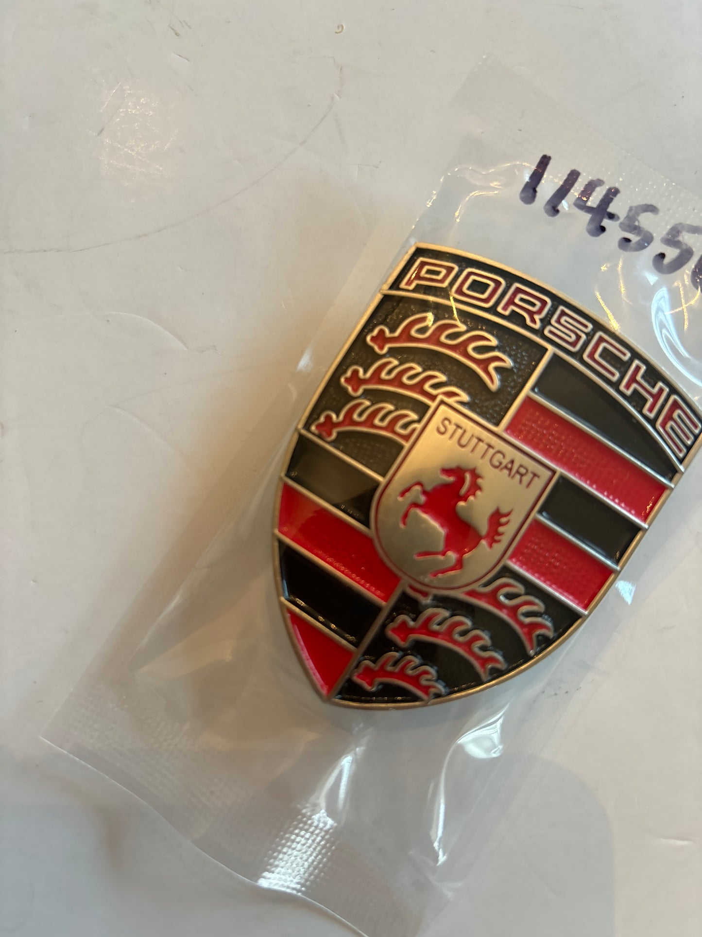 Porsche hood badge, red silver black