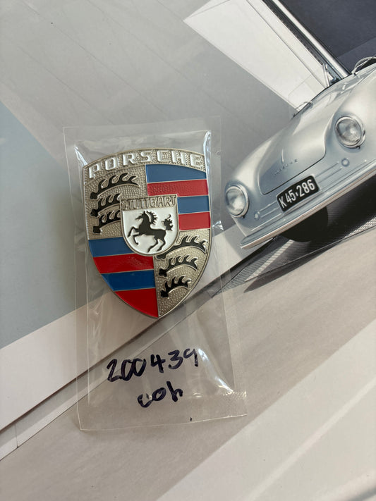 Porsche, red white and blue Crest hood badge