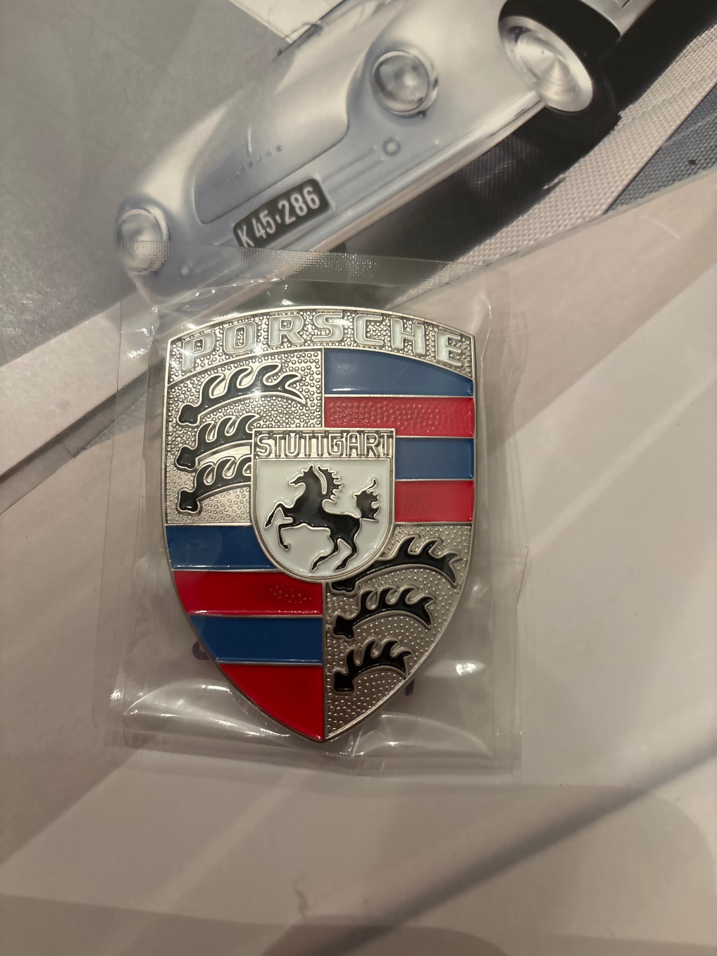 Red white and blue Porsche Hood crest