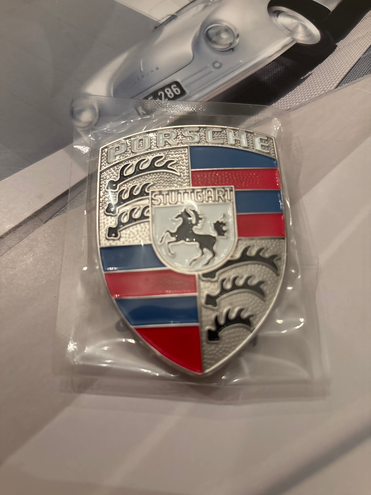 Red white and blue Porsche Hood crest